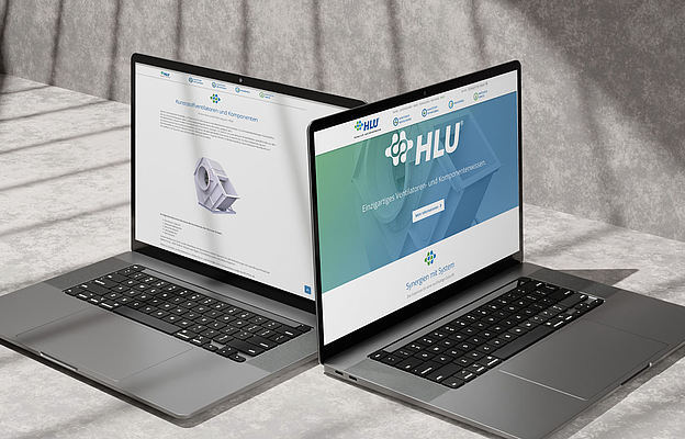 Zwei Versionen der HLU Website auf Laptops